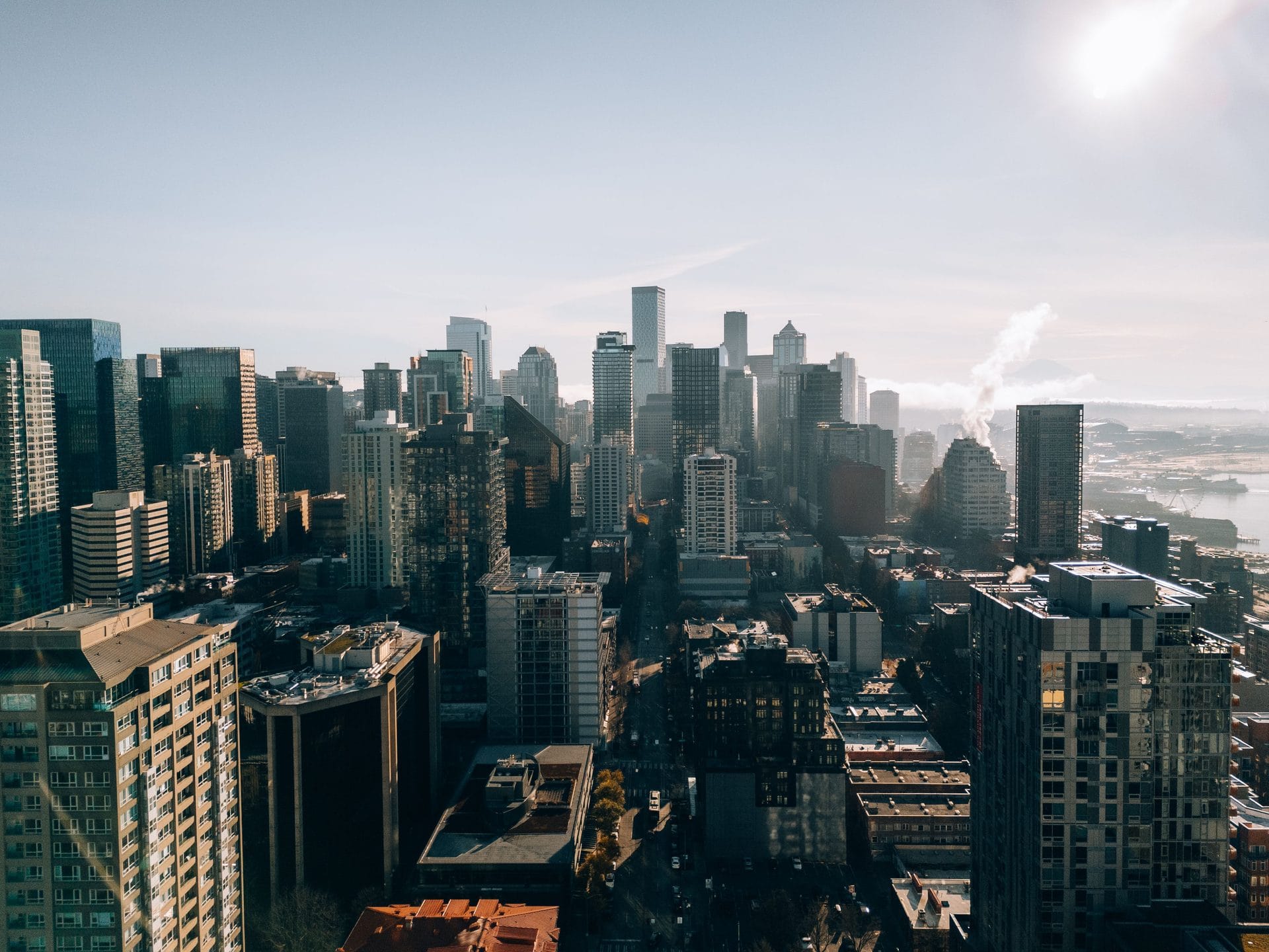 Aerial view of a major city skyline at golden hour